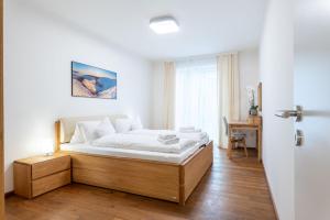 Posteľ alebo postele v izbe v ubytovaní Apartmány Resort Vrchlabí
