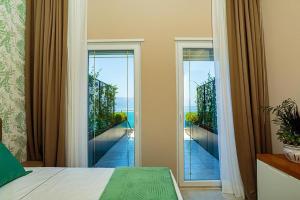 Postel nebo postele na pokoji v ubytování Toto Hotel & Apartments