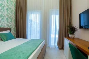 Postel nebo postele na pokoji v ubytování Toto Hotel & Apartments