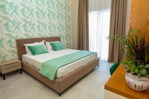 Postel nebo postele na pokoji v ubytování Toto Hotel & Apartments