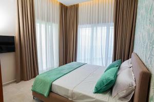 Postel nebo postele na pokoji v ubytování Toto Hotel & Apartments