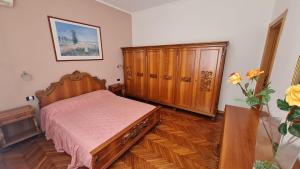 Postel nebo postele na pokoji v ubytování Appartamento BERIMBAU vicino Malpensa