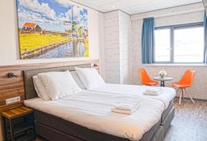 Postel nebo postele na pokoji v ubytování Harbour Hotel IJmuiden