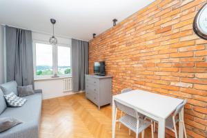 Posedenie v ubytovaní Przytulny Apartament 3city z Dwiema Sypialniami w Gdyni by Noclegi Renters