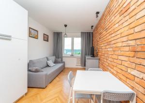 Posedenie v ubytovaní Przytulny Apartament 3city z Dwiema Sypialniami w Gdyni by Noclegi Renters