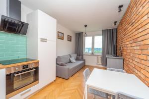 Kuchyňa alebo kuchynka v ubytovaní Przytulny Apartament 3city z Dwiema Sypialniami w Gdyni by Noclegi Renters