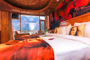 A bed or beds in a room at Hotel Smugglers Mountain View - central heated & air Cooled #Free Pick from Volvo Bus Stand