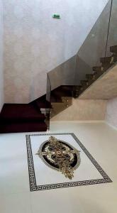 a room with a plate on the floor and a staircase at Hotel Solymar in Mangalia