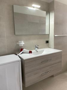 Kylpyhuone majoituspaikassa La Perla Mare Apartments