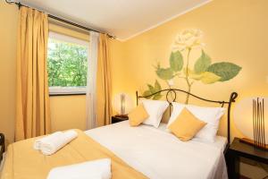 Lotus Resort tesisinde bir odada yatak veya yataklar