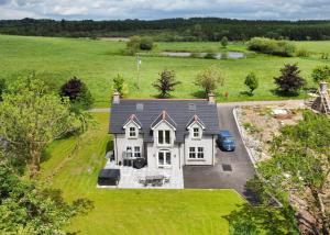 an aerial view of a large white house at Escape Ordinary at Lily's Pad in Enniskillen