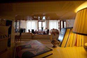 a living room with a couch and a table at Napoli Porta Di Mare in Naples