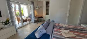 a living room with a couch and a balcony at CUBE apartments in Vir