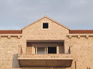a building with a window on the side of it at Anton in Povlja