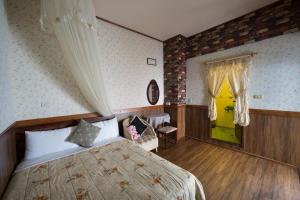 Postel nebo postele na pokoji v ubytování Puli Town B&B