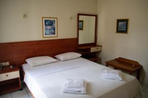 Ένα ή περισσότερα κρεβάτια σε δωμάτιο στο Egnatia Hotel