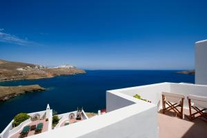 a view of the ocean from the balcony of a house at Arhitektoniki Studios in Astypalaia +22 photos