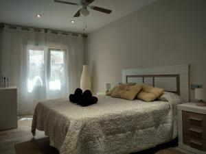 Ένα ή περισσότερα κρεβάτια σε δωμάτιο στο Casa Rural El Caño