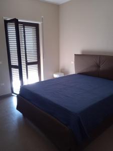 A bed or beds in a room at Le Zagare b&b