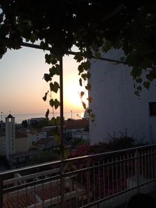 The sunrise or sunset as seen from a panziókat or nearby