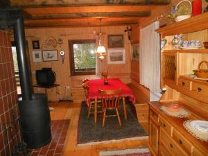 a dining room with a table in a cabin at Holiday Home Gobela in Kranjska Gora