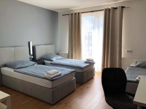Postel nebo postele na pokoji v ubytování Pension Lara