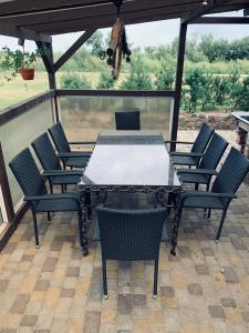 a table and chairs sitting on a patio at VERTIKĀLES in Liepāja