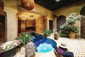 a large room with a large pool of water at Riad Zhor in Marrakesh