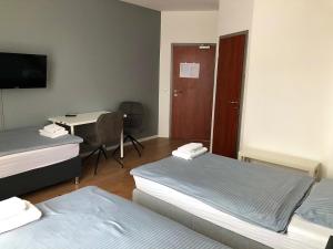 Postel nebo postele na pokoji v ubytování Pension Lara