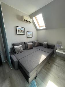 a large bed in a room with a window at SP Luxury Loft 28 in Ravda +15 photos
