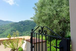 a balcony with a gate with a view of mountains at casa n'donda in Cuccaro Vetere