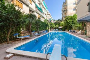 a swimming pool in front of a building at Estate4Home - Casa Maridea in Sorrento
