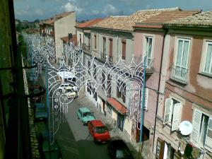 a view of a street with cars and buildings at b&b palazzo neri in Vibo Valentia