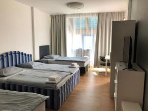 Postel nebo postele na pokoji v ubytování Pension Lara