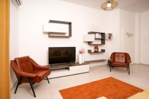 Telewizja i/lub zestaw kina domowego w obiekcie Ortigia Boutique Plaza Apt