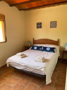 A bed or beds in a room at Air Conditioned "Casa Tropicana" Entire Villa or Individual Apartments