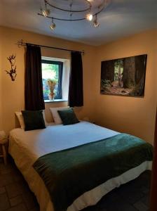 Postel nebo postele na pokoji v ubytování Le Clos du Cerf - Le Sous-bois + 23 fotografií