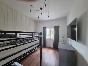 En eller flere senge i et værelse på Vintage Resort