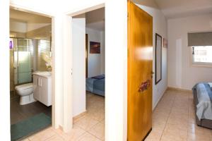 a bathroom with a sink and a toilet in a room at MyNapa Apartments in Ayia Napa +85 photos