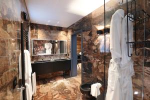 a bathroom with a shower and a sink and a mirror at Chalet Blanc Cervinia in Breuil-Cervinia