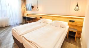 Posteľ alebo postele v izbe v ubytovaní Resort Sněžné AMANITA