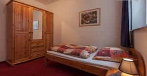 a bedroom with a bed with two pillows on it at Landhaus Müller in Reith im Alpbachtal