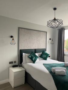 a bedroom with a large bed and a large window at Whites Hotel in Newcastle upon Tyne
