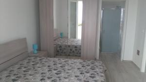 Кровать или кровати в номере Zona Maldive del Salento, Vistamare1, Sabbia 10' a piedi, BBQ, 2 Bagni, 2 Clima, Posto Auto Esclusivo