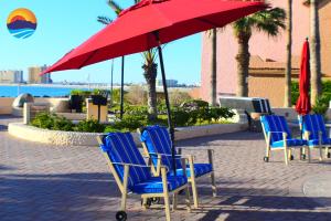 a group of chairs sitting under an umbrella at Marina Pinacate B-419 in Puerto Peñasco