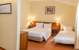 Cama ou camas em um quarto em Hotel Belsol