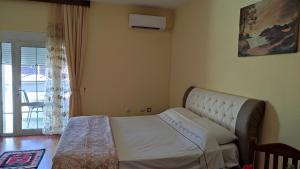 Een bed of bedden in een kamer bij Guest House Katerina
