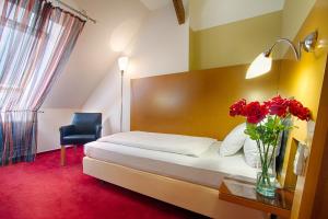 Posteľ alebo postele v izbe v ubytovaní Theatrino Hotel