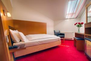 Posteľ alebo postele v izbe v ubytovaní Theatrino Hotel