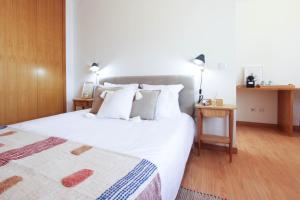 Ένα ή περισσότερα κρεβάτια σε δωμάτιο στο Casa do Condado